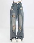 Women's distressed washed jeans