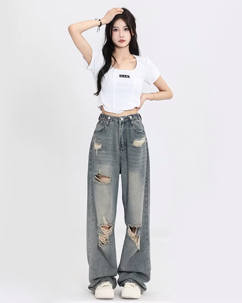 Women&#39;s distressed washed jeans