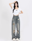 Women's distressed washed jeans