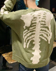 Green skeleton sweater